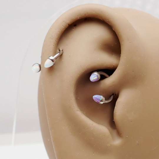 Black horseshoe body jewelry with 3mm spiked opal cone ends, 16g size, featuring a bold, spiked design for pierced ears or body piercings.