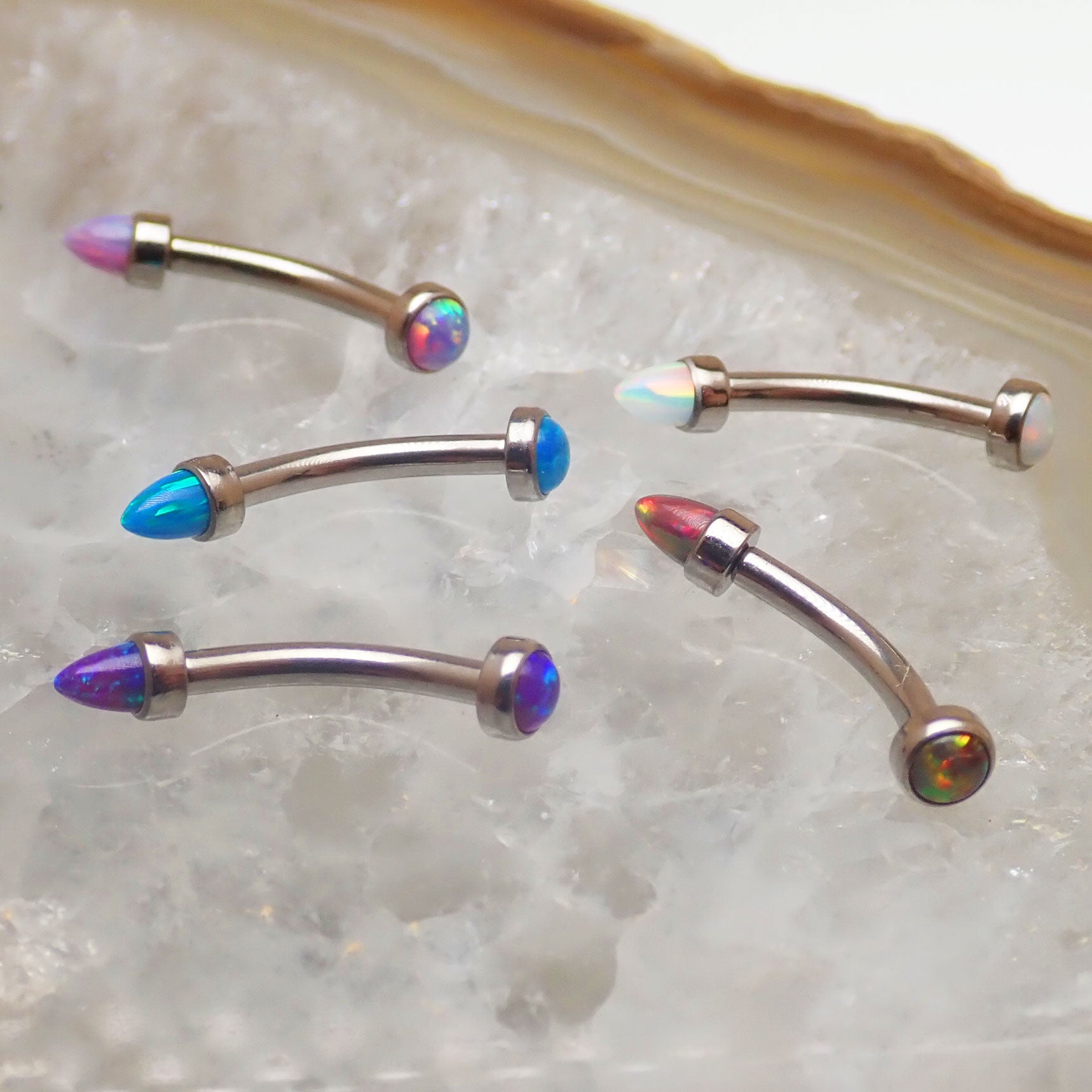 Micro Curve Titanium Piercing with Cone and Flat Top Opals in 16g body jewelry, featuring black fire design and titanium material.