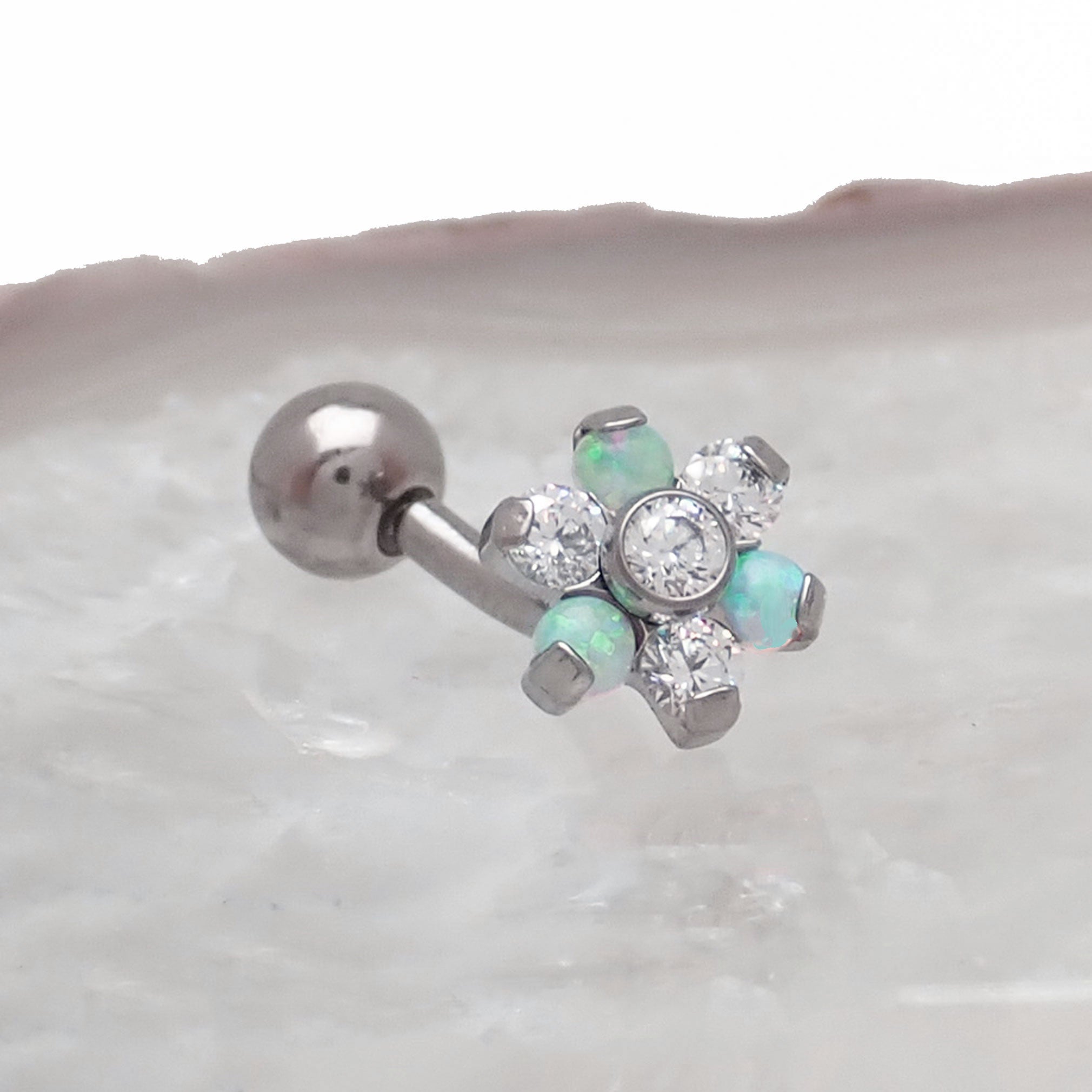 Opal Flower Curved Barbell 16g body jewelry with clear CZ stones from Body Clickers, featuring a floral design and curved shape.