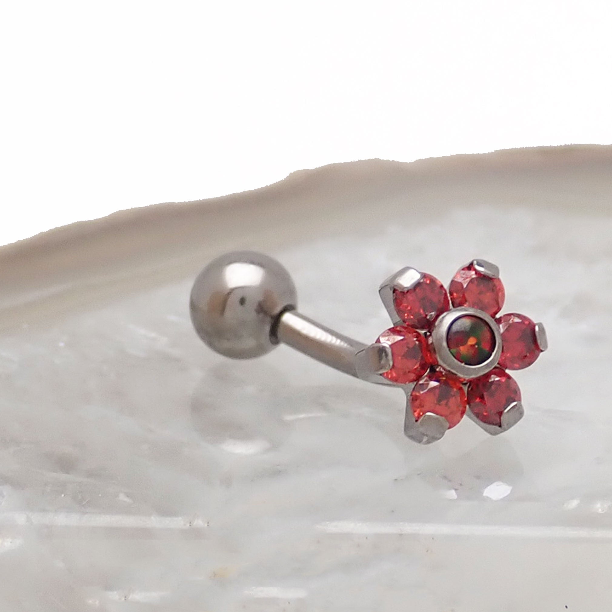 Opal flower curved barbell body jewelry in 16g with clear CZ stones, featuring a floral design by Body Clickers Body Jewelry