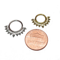 Beaded filigree titanium clicker body jewelry in 16g with intricate design and a penny charm, ideal for body piercing.