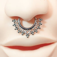 Beaded filigree titanium clicker body jewelry in 16g with intricate design and secure clasp for body piercing.