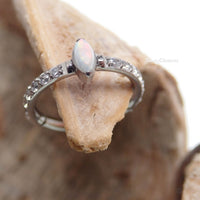 Tear drop opal clicker body jewelry in 16g with an 8mm opal gemstone, designed for body piercing by Body Clickers Body Jewelry.