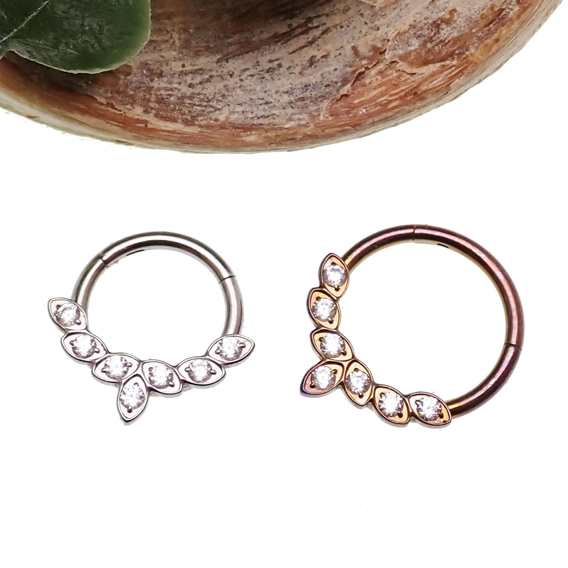 Titanium CZ leaf body jewelry clicker in 16g with 8mm size, featuring a sleek leaf design from Body Clickers Body Jewelry.