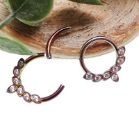 Titanium CZ leaf body jewelry clicker in 16g with 8mm size, featuring a sleek leaf design by Body Clickers Body Jewelry.