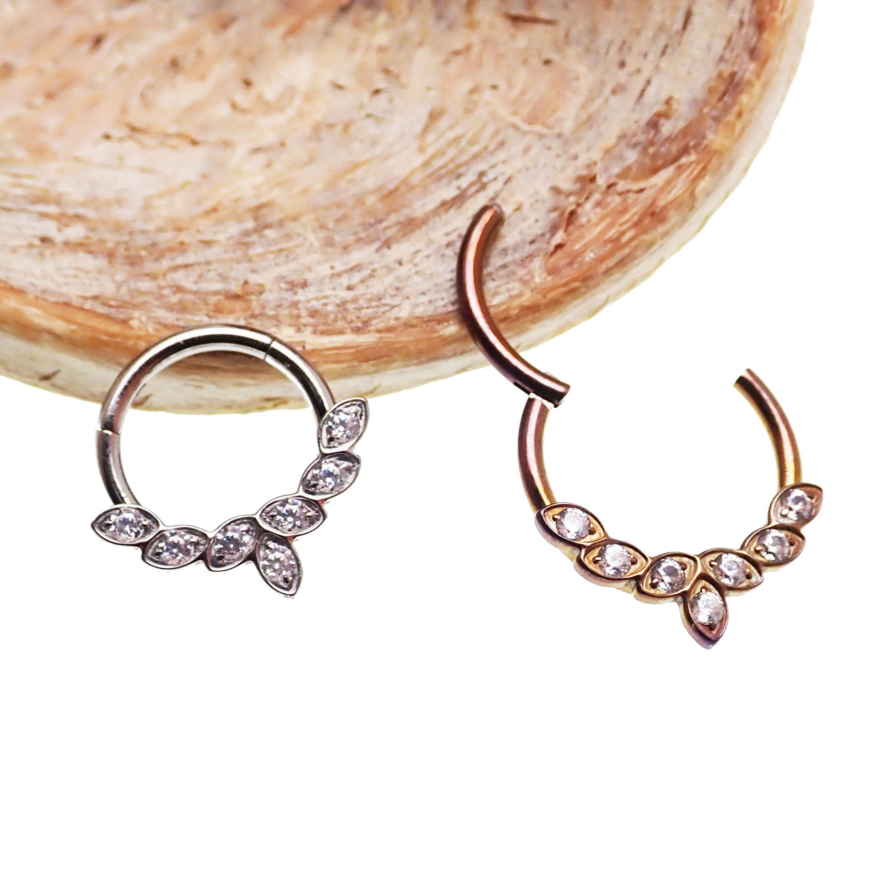 Titanium CZ leaf body jewelry clicker with 16g gauge, featuring a sleek leaf design, by Body Clickers Body Jewelry.