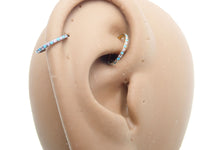 Side-facing turquoise and CZ alternating clicker body jewelry, 18g, by Body Clickers Body Jewelry, showing detailed design.