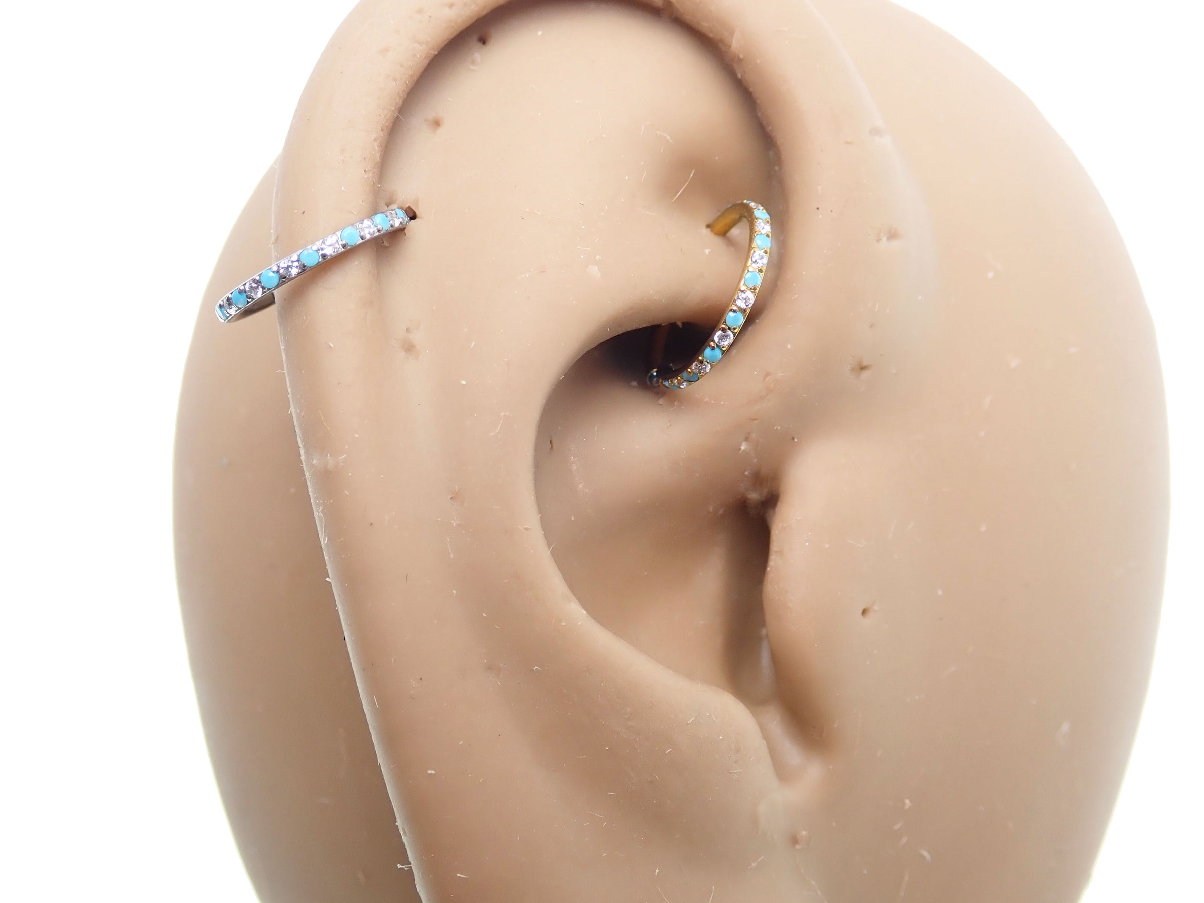 Side-facing turquoise and CZ alternating clicker body jewelry, 18g, by Body Clickers Body Jewelry, showing detailed design.