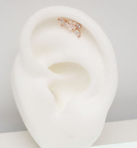 Brass helix flower body jewelry with CZ stones, 16g piercing, featuring a decorative steel flower design for ear piercings.