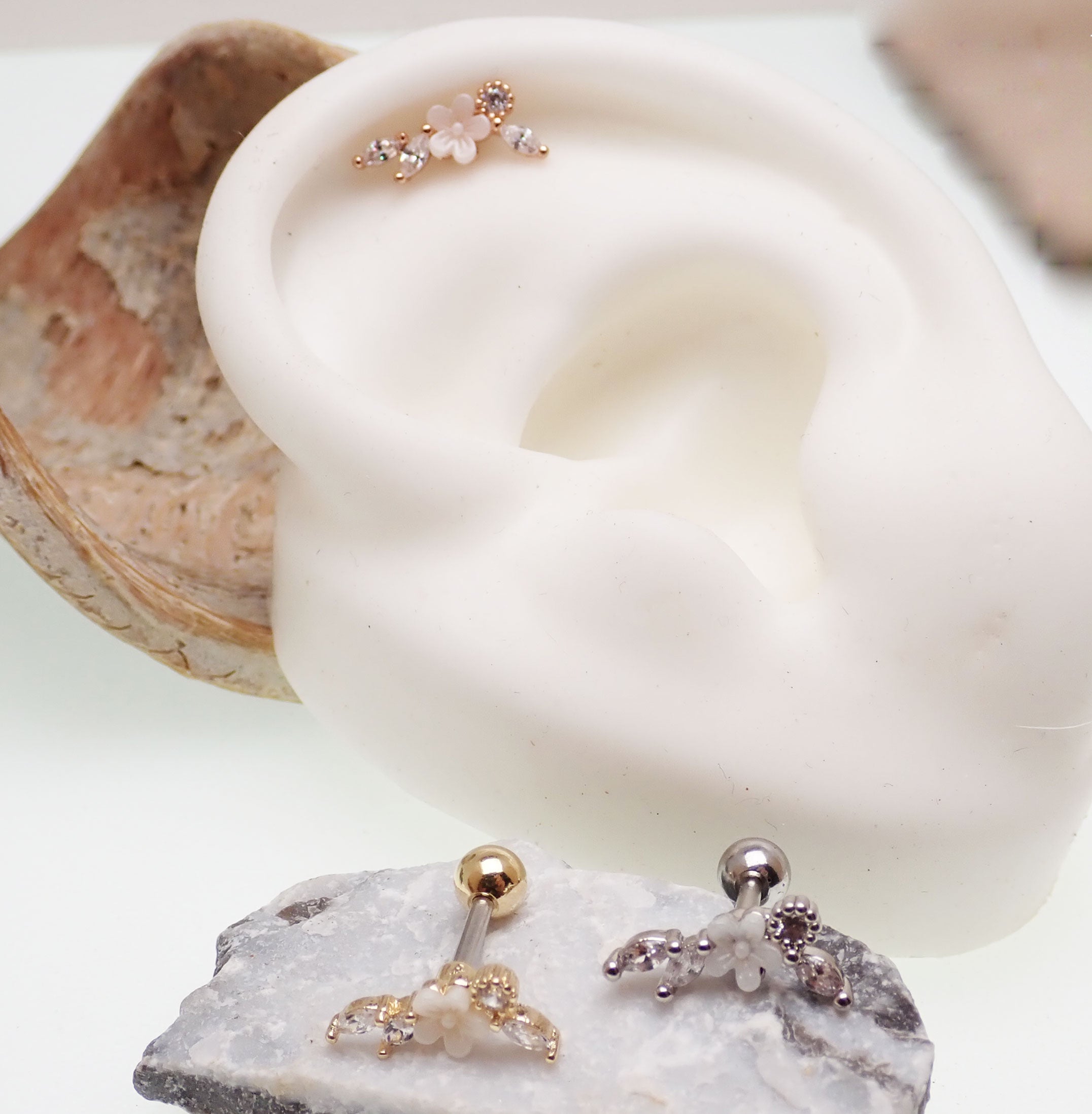 Brass helix flower body jewelry with CZ stones, 16g piercing, featuring a steel and brass design with floral and gemstone details.