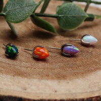 Orange push fit bullet opal ends for body jewelry by Body Clickers, featuring smooth, rounded design and vibrant gemstone accents.