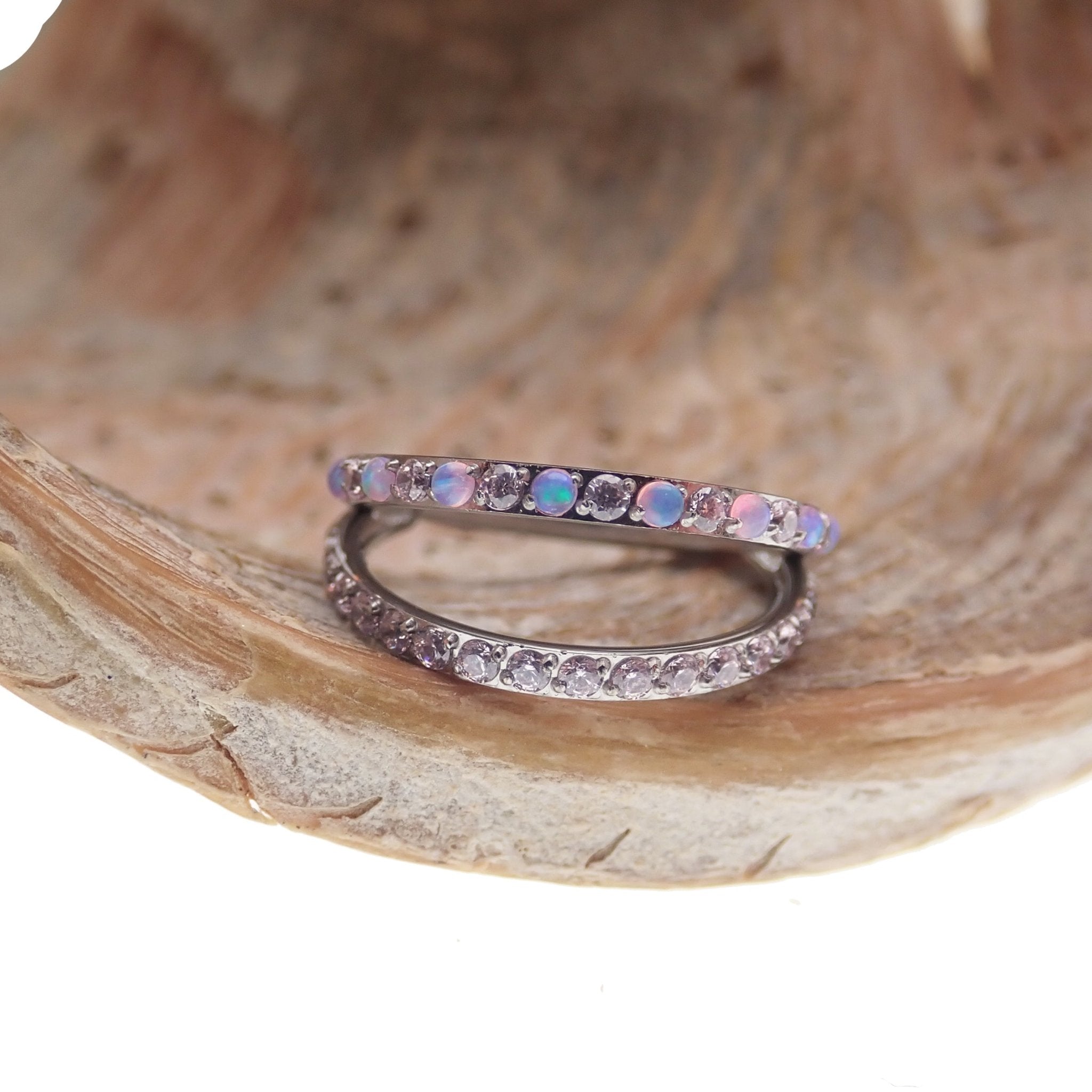 Double layer 16g split opal and CZ titanium clicker body jewelry featuring sparkling gemstones and sleek silver design.