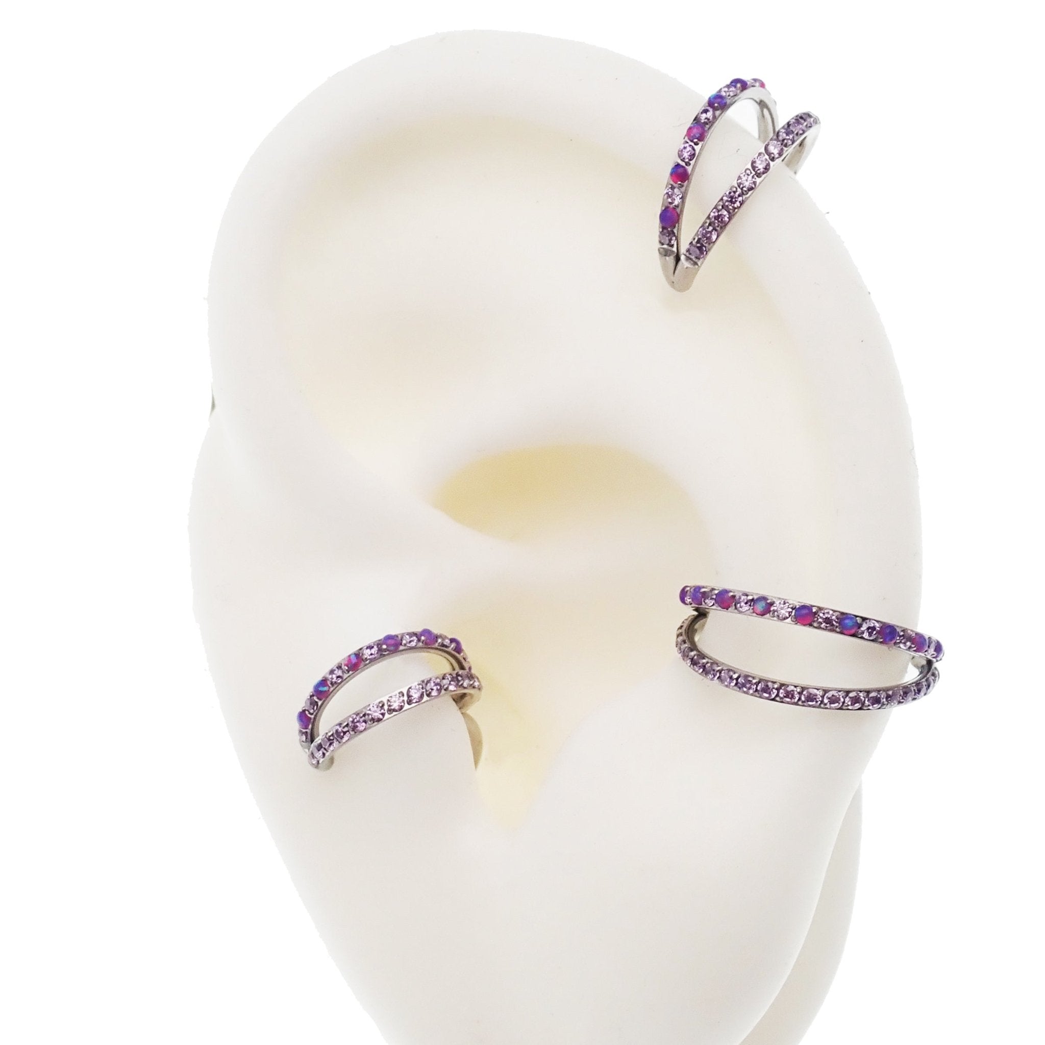 Double layer 16g split opal and cubic zirconia titanium clicker body jewelry with sleek design and secure clicker clasp.