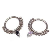 Beaded titanium teardrop clicker ring for body jewelry, 16g, with intricate bead detailing and sleek design.