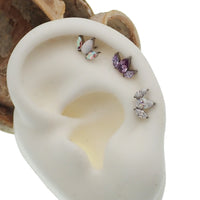 Clear CZ petal flower body jewelry by Body Clickers, push fit flatback design in 14g, 16g, and 18g sizes.