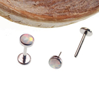 Fire opal 4mm push fit flat back body jewelry by Body Clickers in cornflower blue, available in 16g and 18g sizes.
