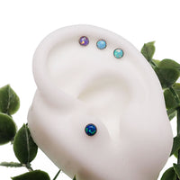 Fire Opal 4mm push fit flat back body jewelry by Body Clickers in 16g and 18g, featuring a vibrant cornflower blue design.