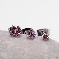 Three pairs of clear CZ prong earrings for body jewelry, made by Body Clickers, featuring 20g gauge with sparkling crystals.