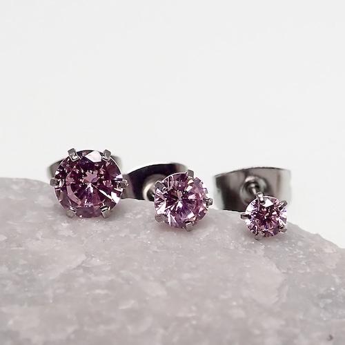 Three pairs of clear CZ prong earrings for body jewelry, made by Body Clickers, featuring 20g gauge with sparkling crystals.