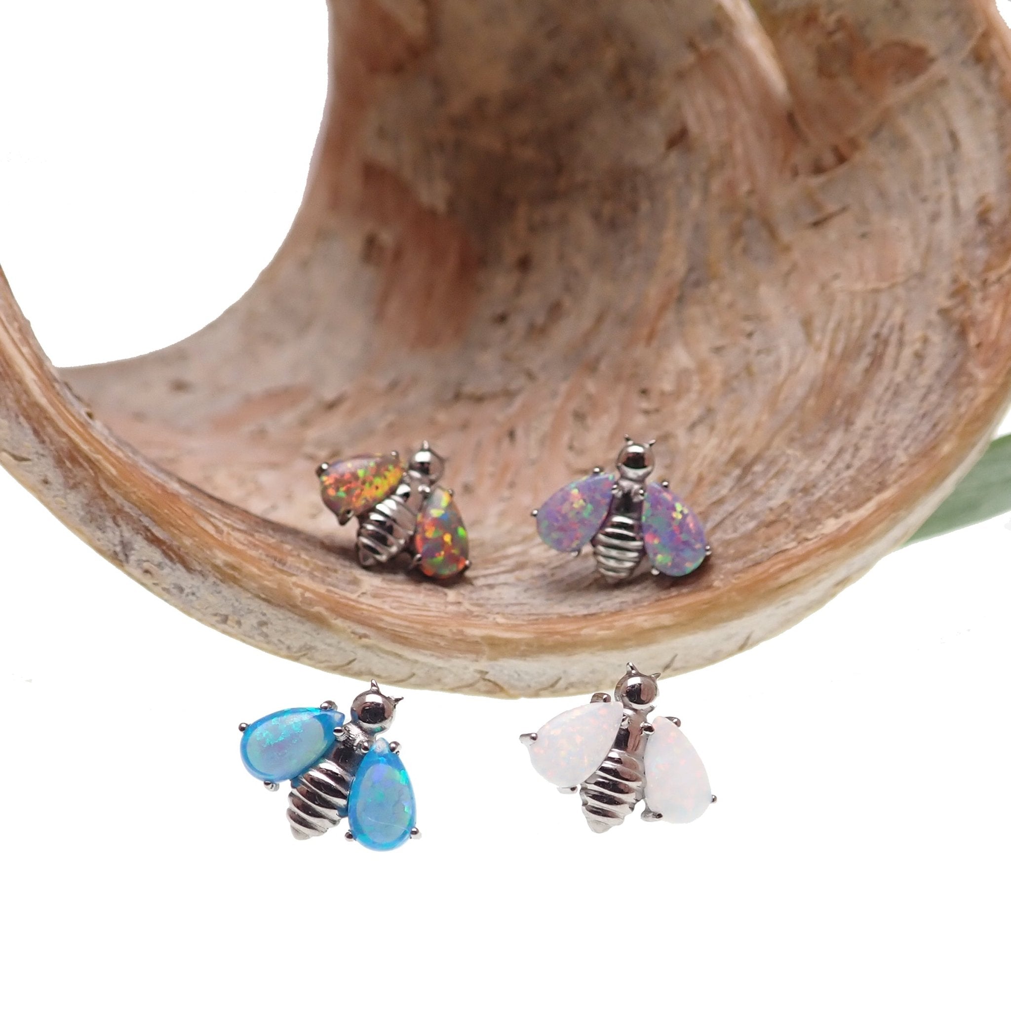 Dark cherry Opal Bee Titanium flat back body jewelry by Body Clickers in 14g, 16g, and 18g sizes.