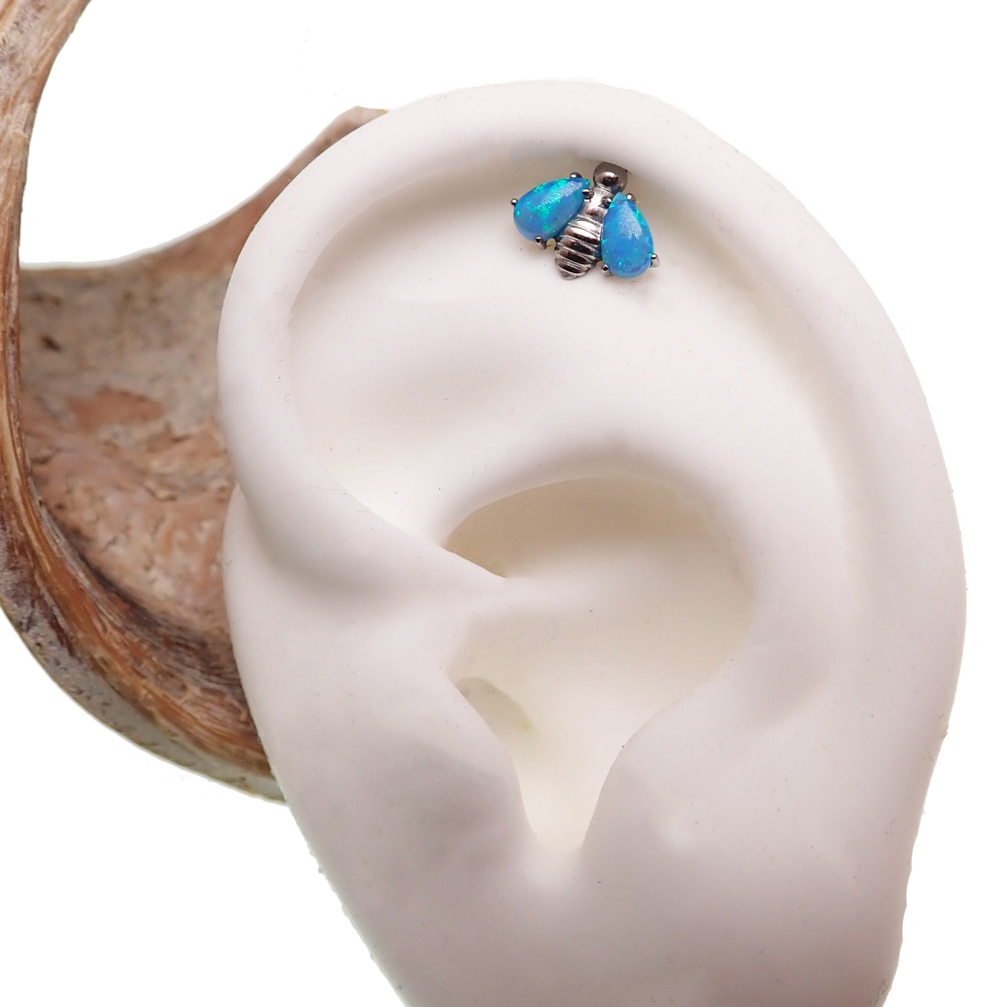 Dark cherry Opal Bee titanium flat back body jewelry by Body Clickers in 14g, 16g, and 18g gauges.