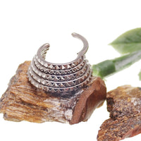 5-tier stacked engraved clicker body jewelry with intricate design, made by Body Clickers for septum piercing.