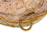 CZ 14k gold hinged clicker ring body jewelry with a 16g gauge and secure clasp, designed for piercings and body adornment.