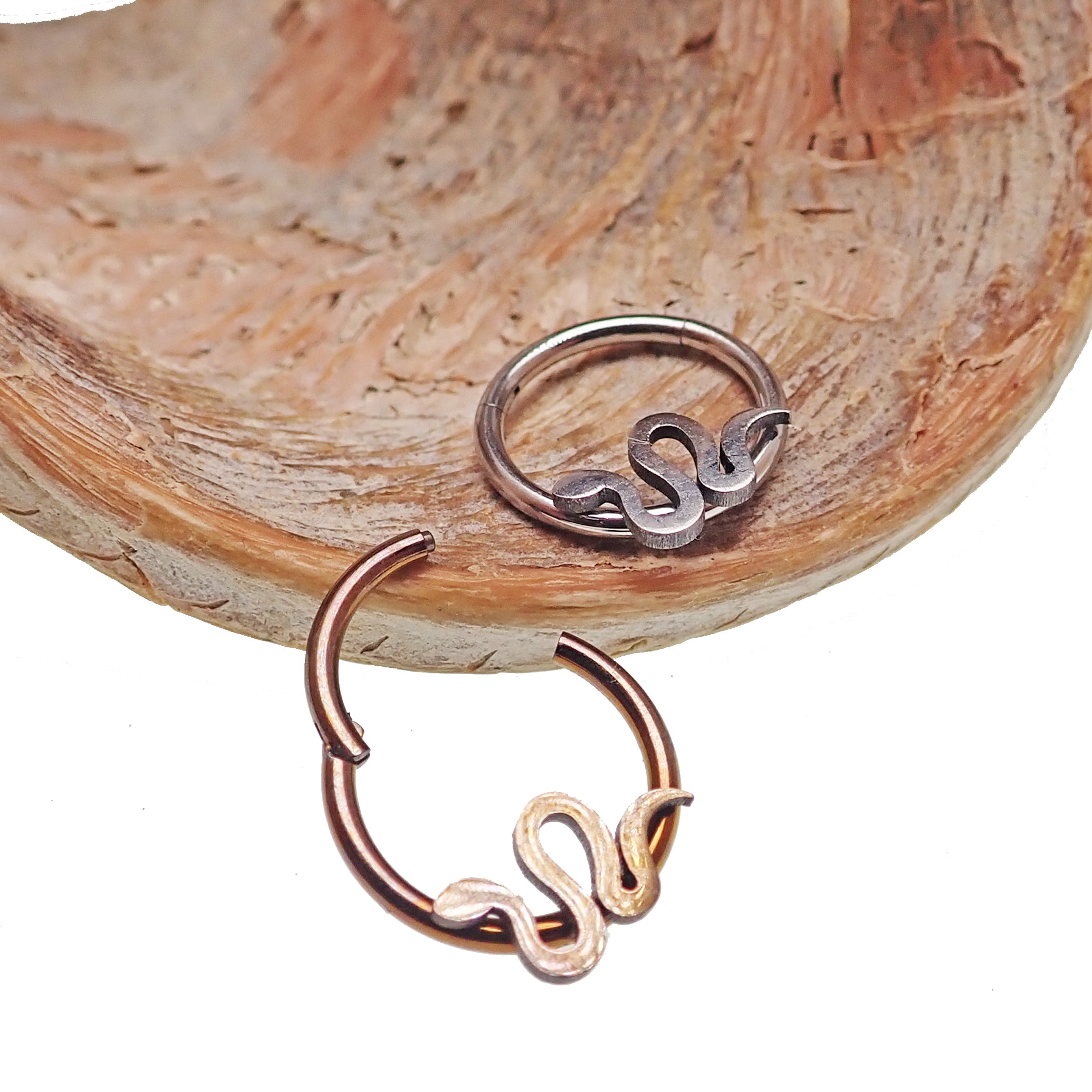 Flat Snake Clicker 16g body jewelry by Body Clickers, showing a sleek, silver-colored clicker with a flat snake design.