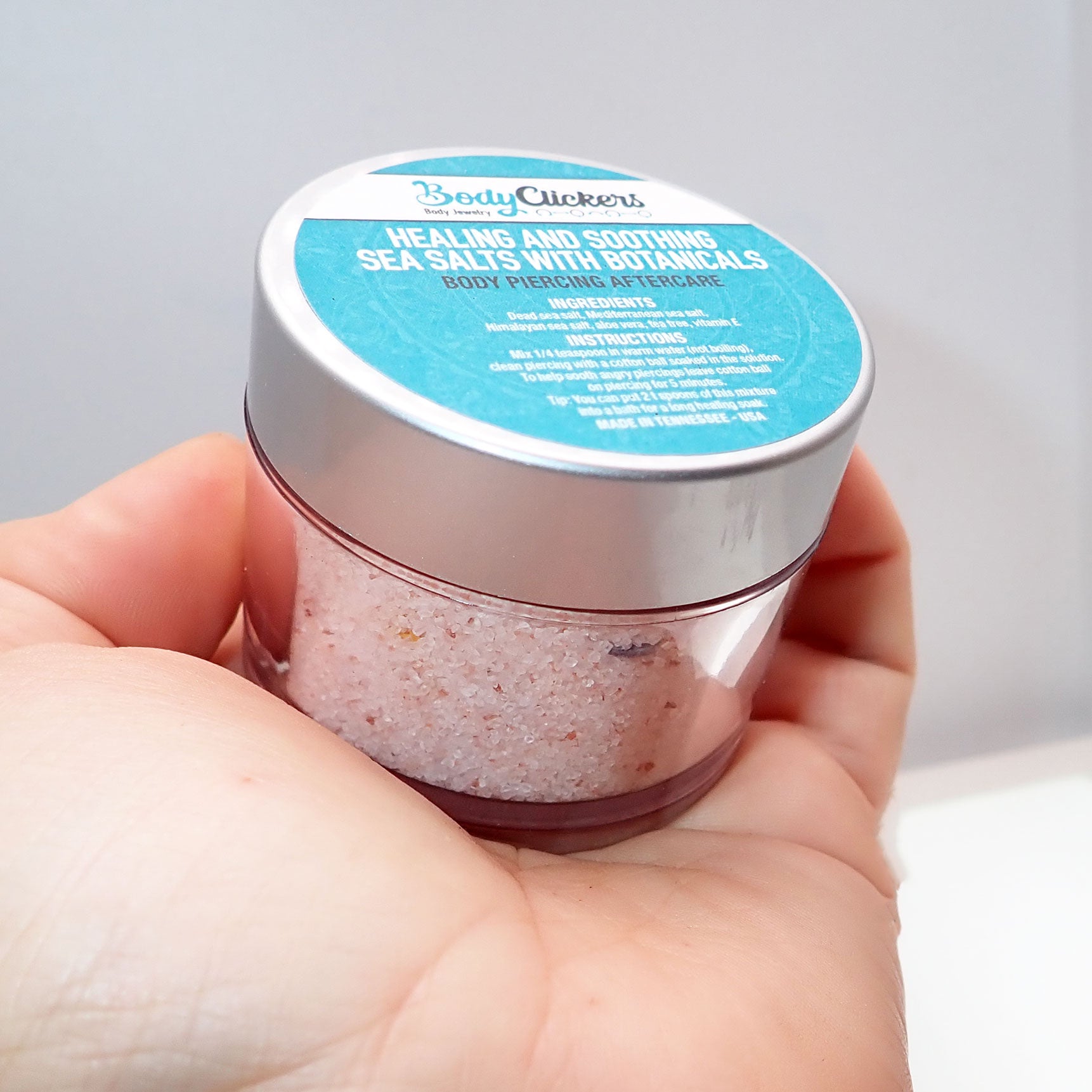Healing Salt Body Piercing Aftercare by Body Clickers, showing a jar of healing salt for body jewelry care and healing.