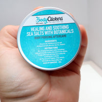 Healing Salt Body Piercing Aftercare by Body Clickers, close-up of the product packaging with salt for piercing healing.