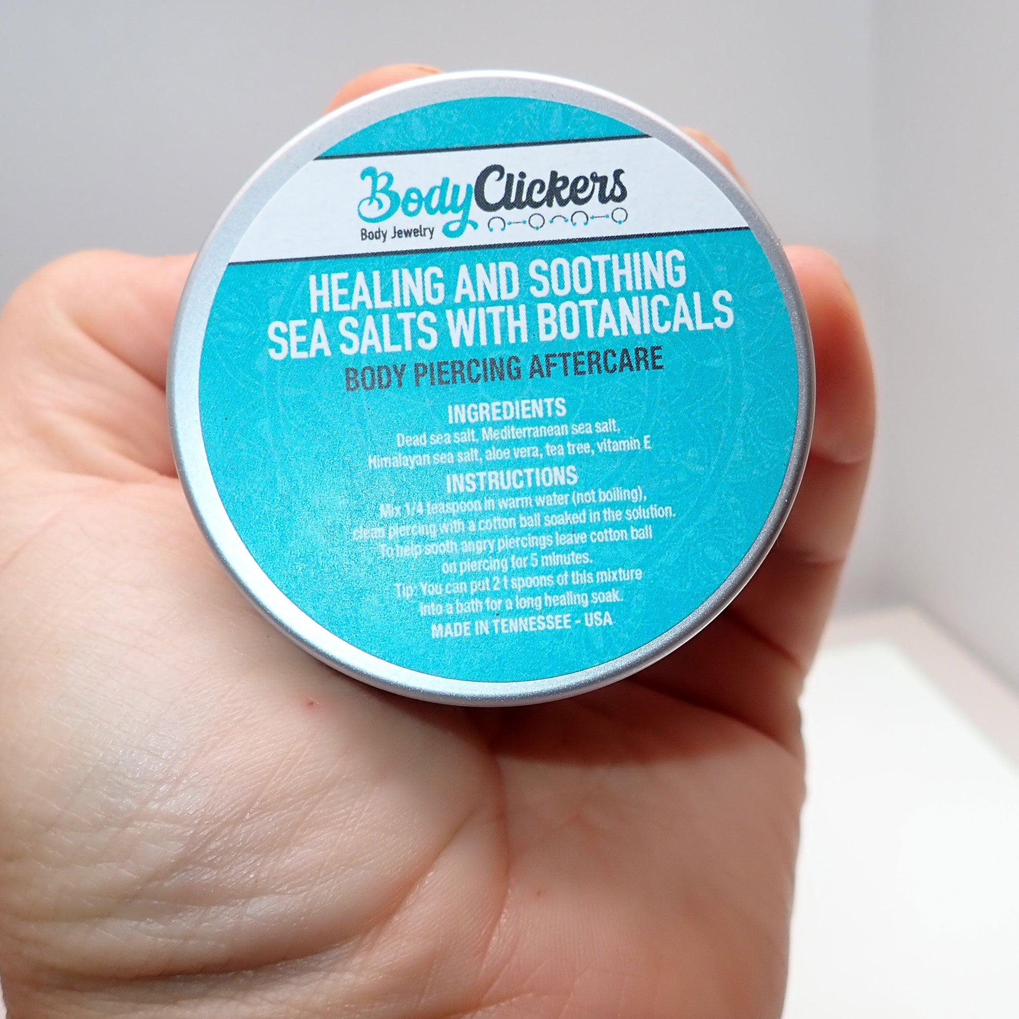 Healing Salt Body Piercing Aftercare by Body Clickers, close-up of the product packaging with salt for piercing healing.