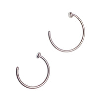 Titanium nose ring with stop by Body Clickers, 20g implant body jewelry, shown in close-up on a white background.
