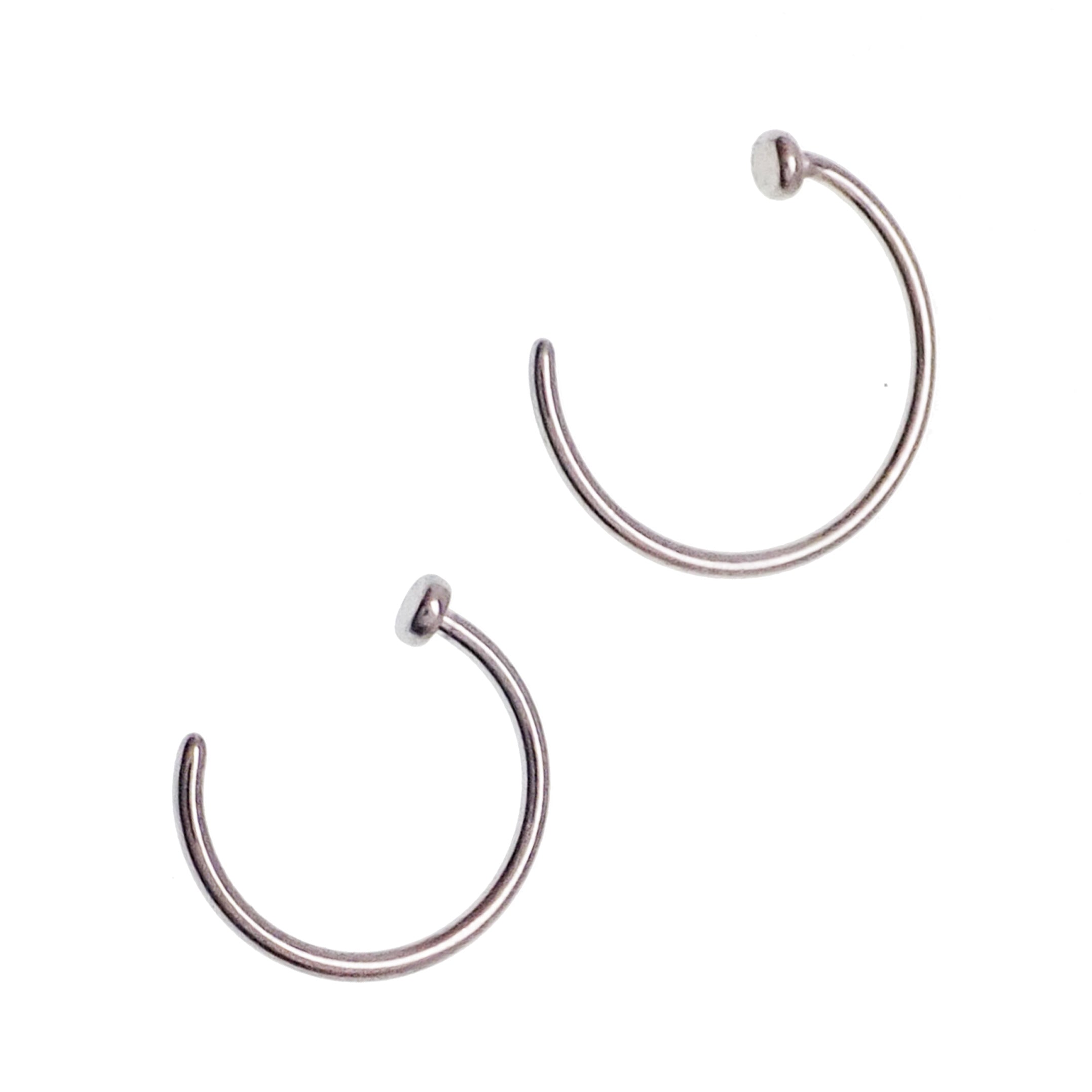 Titanium nose ring with stop by Body Clickers, 20g implant body jewelry, shown in close-up on a white background.