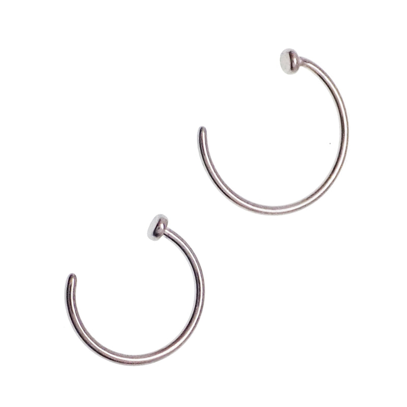 Titanium nose ring with stop by Body Clickers, 20g implant body jewelry, shown in close-up on a white background.