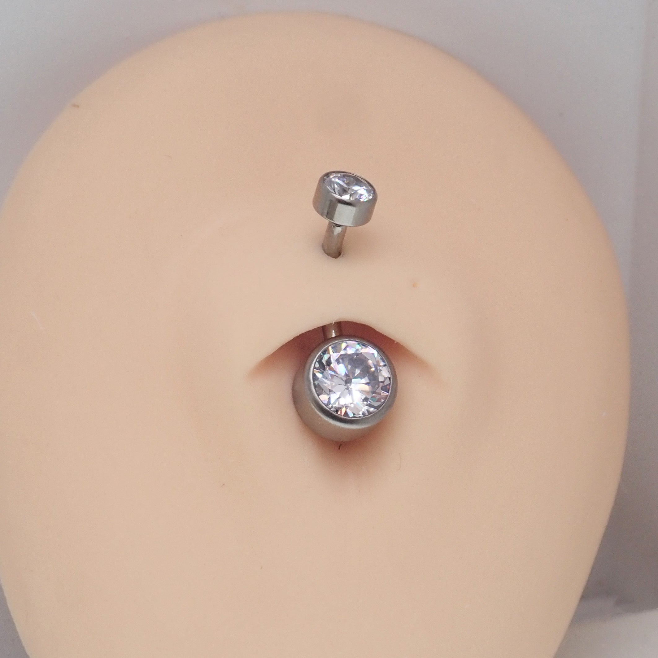 Internally threaded AB cubic zirconia belly bar by Body Clickers, 14g body jewelry with sparkling gemstone and silver-tone finish.