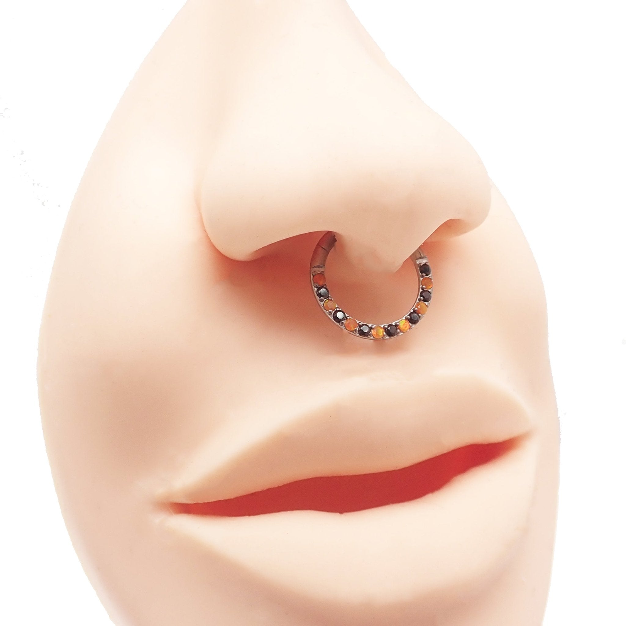 Orange and black CZ titanium clicker body jewelry in 16g with sleek design from Body Clickers.