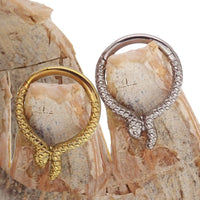 Snake titanium septum and daith clicker jewelry, 16g, 8mm, from Body Clickers Body Jewelry, featuring a sleek snake design.