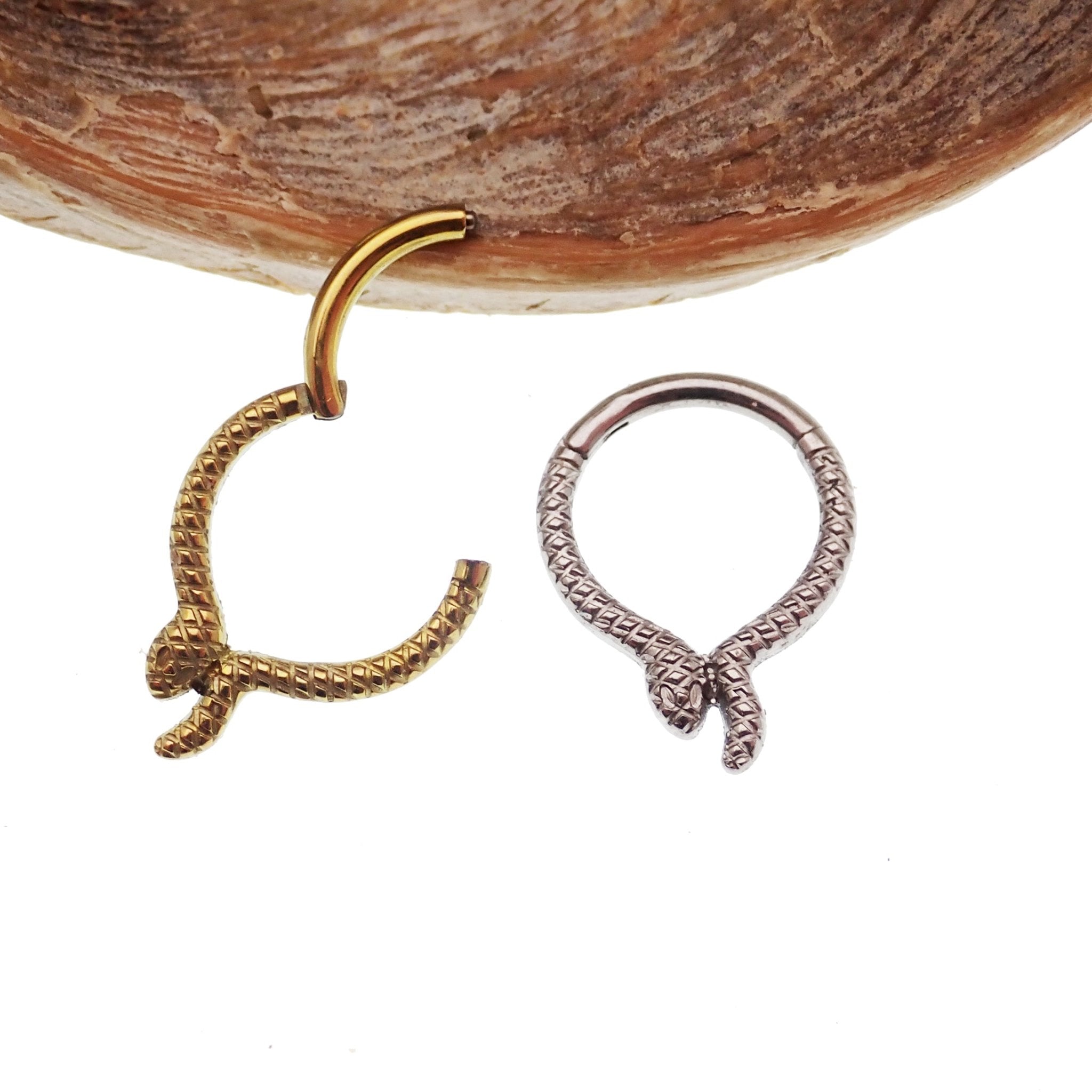 Snake titanium septum and daith clicker in 16g size with an 8mm length, featuring a sleek snake design from Body Clickers Body Jewelry.