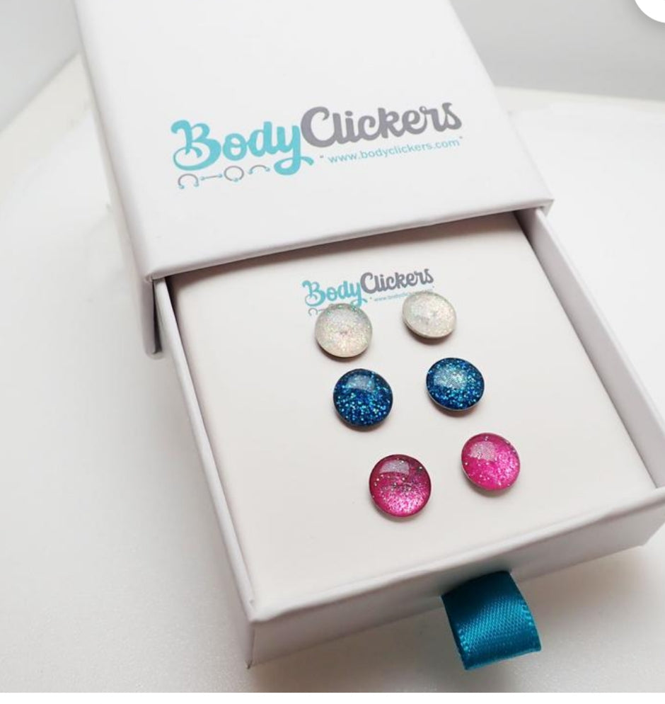 Sparkly stainless steel earrings by Body Clickers Body Jewelry featuring shiny, reflective surfaces and elegant design.