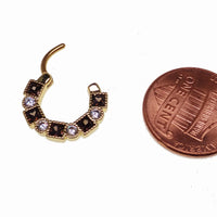 Steel clicker body jewelry with amber and clear CZ stones, 16g, showcasing a stylish and sparkling design.