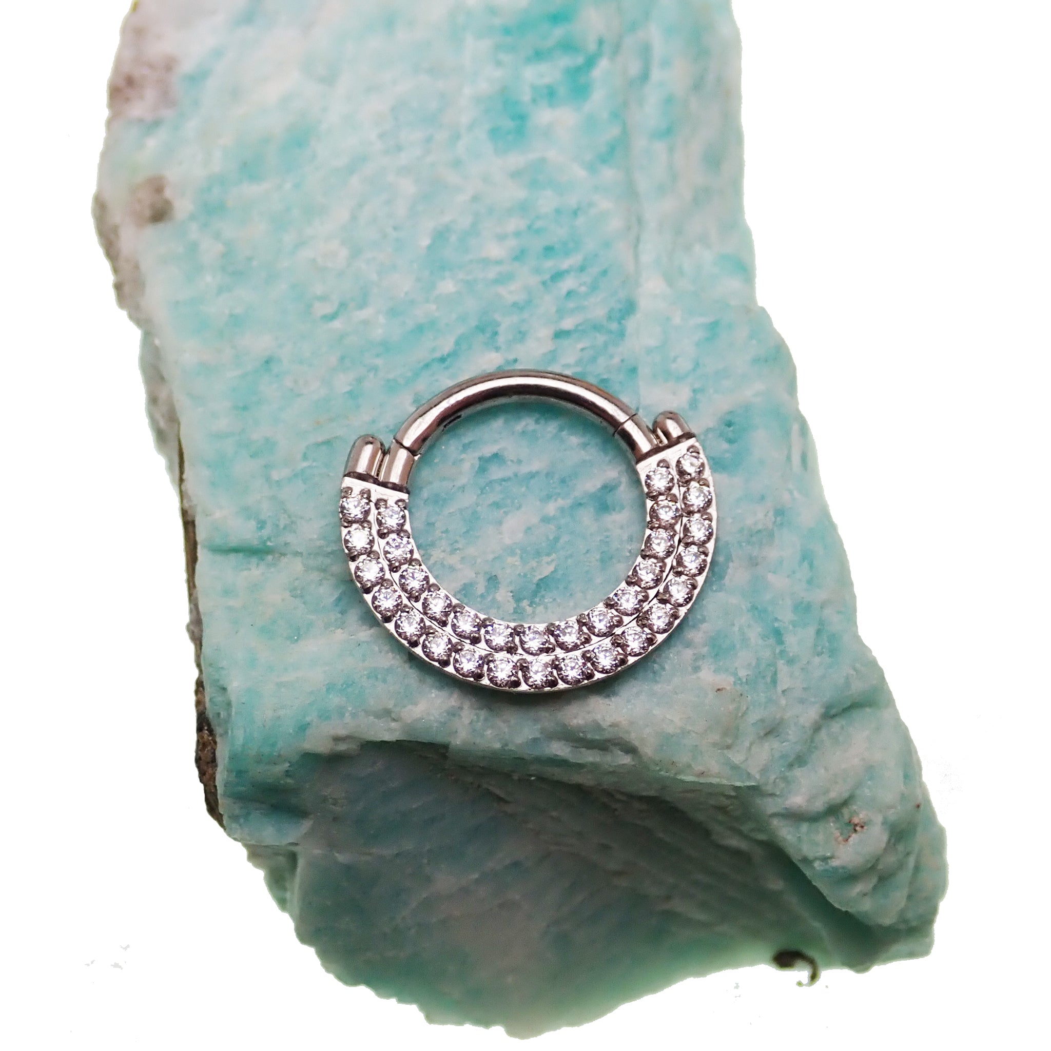 Steel double-row CZ inlaid clicker body jewelry in 16g with a sleek design and sparkling gemstone accents.