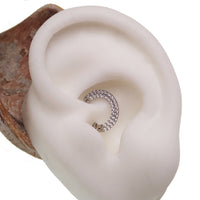 Steel double-row CZ inlaid clicker body jewelry in 16g with sleek design and sparkling cubic zirconia accents.