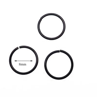 Set of three black steel seamless pull-apart rings for body jewelry, 20g, from Body Clickers, displayed on a white background.