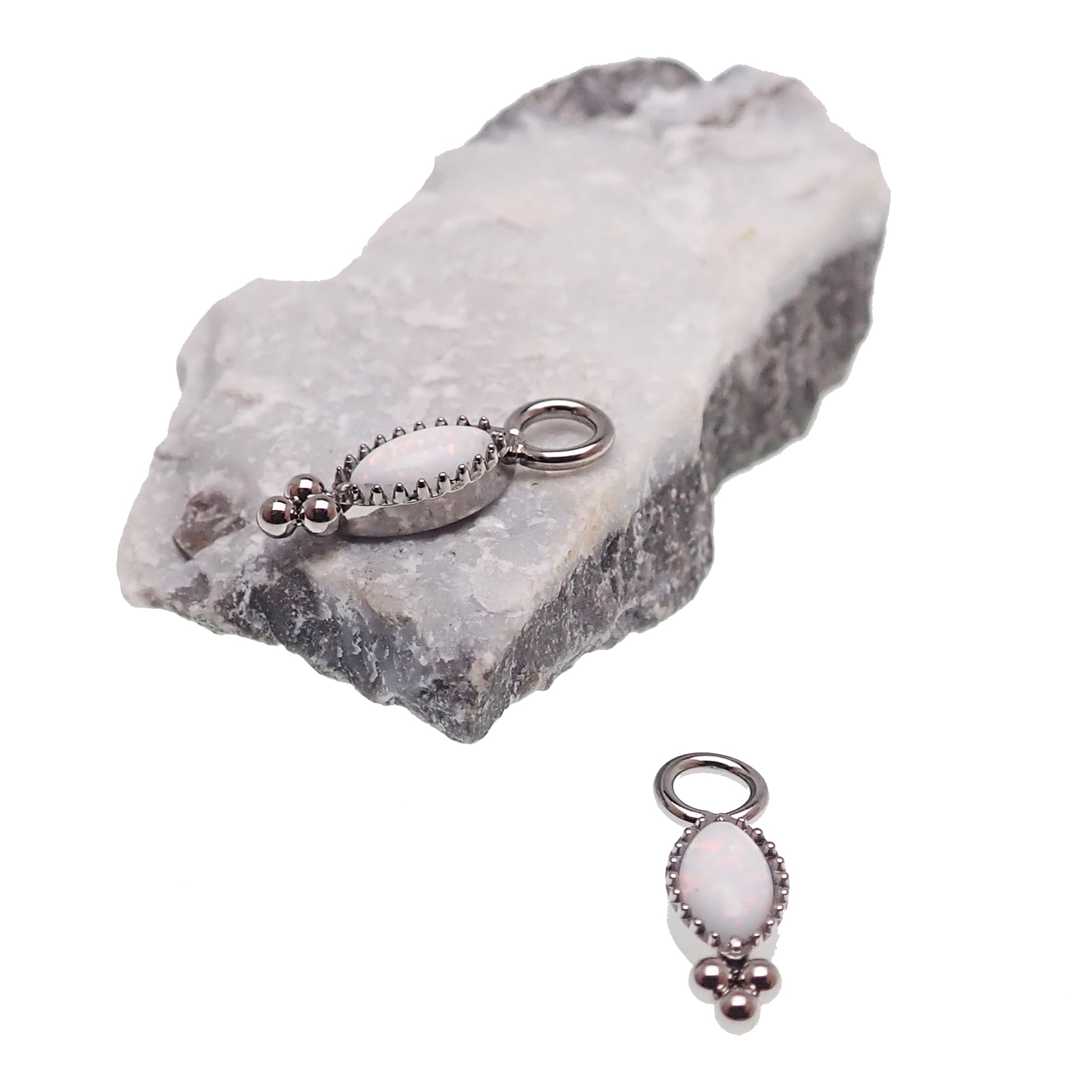 White opal oval beaded CZ charm for body jewelry by Body Clickers, showcasing intricate beaded design and sparkling cubic zirconia.