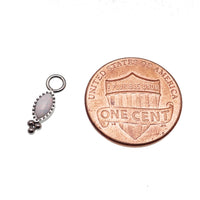 White opal oval beaded CZ charm for body jewelry, designed by Body Clickers, featuring sparkling cubic zirconia accents.