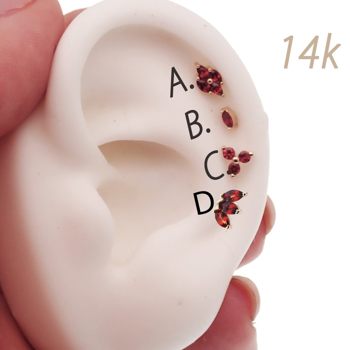 14K gold natural stone garnet flat back labret piercing by Body Clickers Body Jewelry, showcasing the elegant gemstone and sleek design.