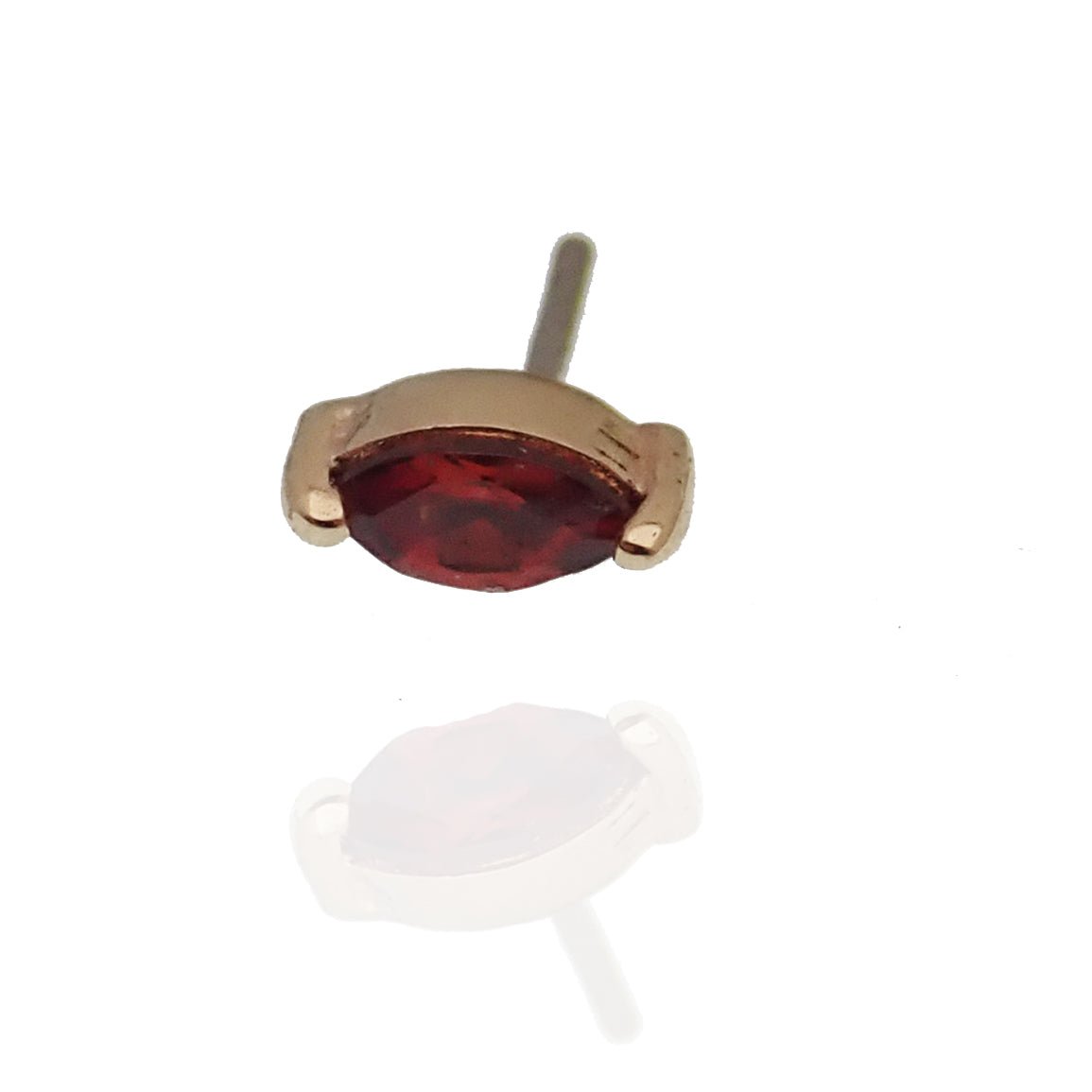 14K natural garnet flat back labret piercing by Body Clickers Body Jewelry, showcasing a vibrant red gemstone against a silver setting.