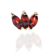 14K gold natural stone garnet flat back labret piercing by Body Clickers Body Jewelry, showcasing the gemstone and sleek design.