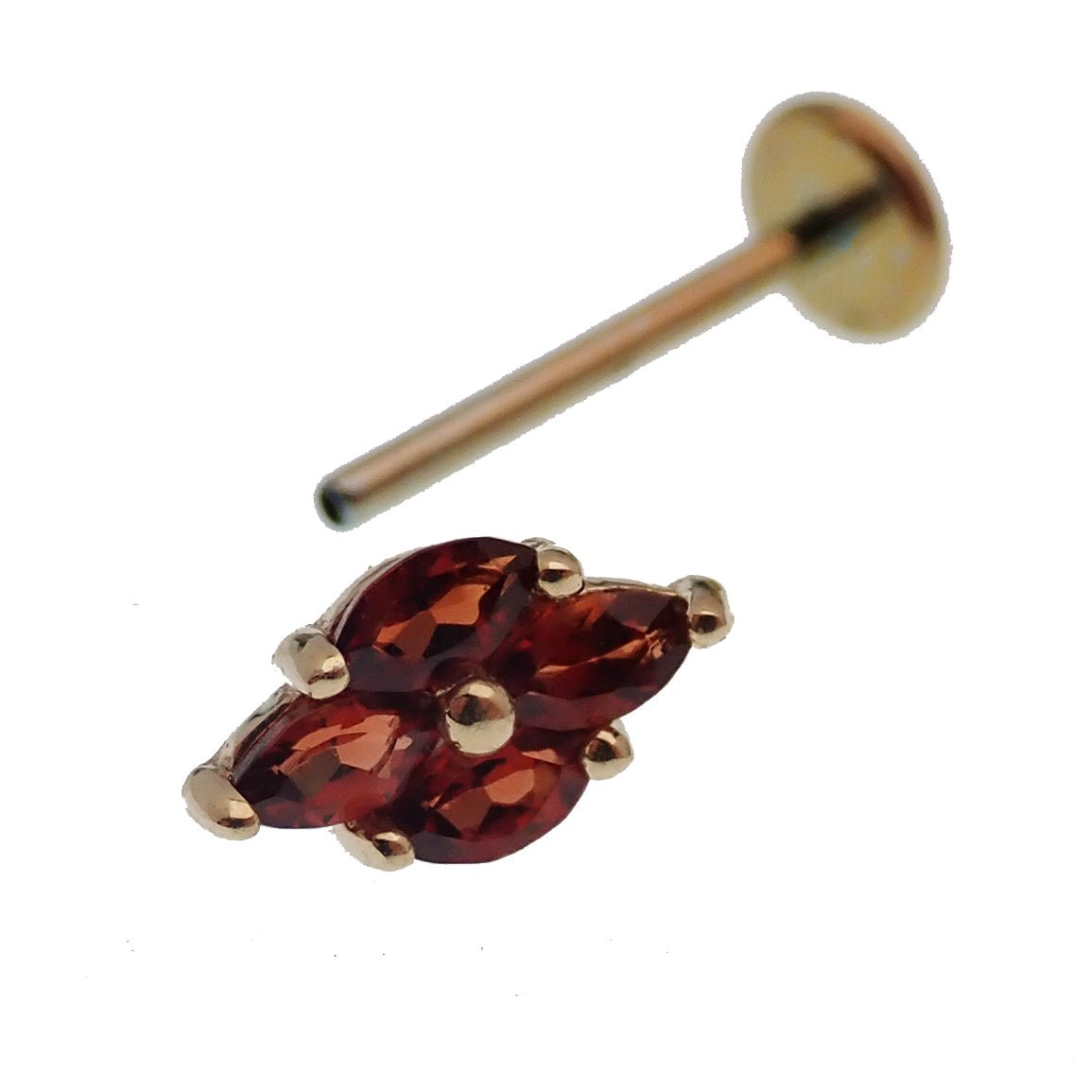 14K gold garnet threadless labret piercing with flat back, featuring a natural red garnet stone and sleek body jewelry design.