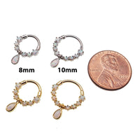 Gold steel septum clicker with opal tear drop charm, 16g body jewelry by Body Clickers, featuring a stylish and secure design.